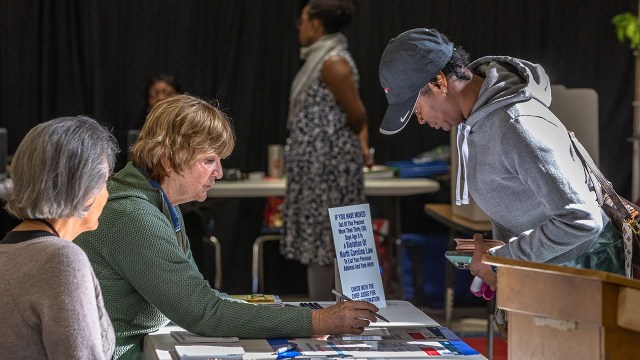 Poll workers assist voters during Super Tuesday elections on March 5, 2024, in Charlotte, North Carolina. (Grant Baldwin/Getty Images)